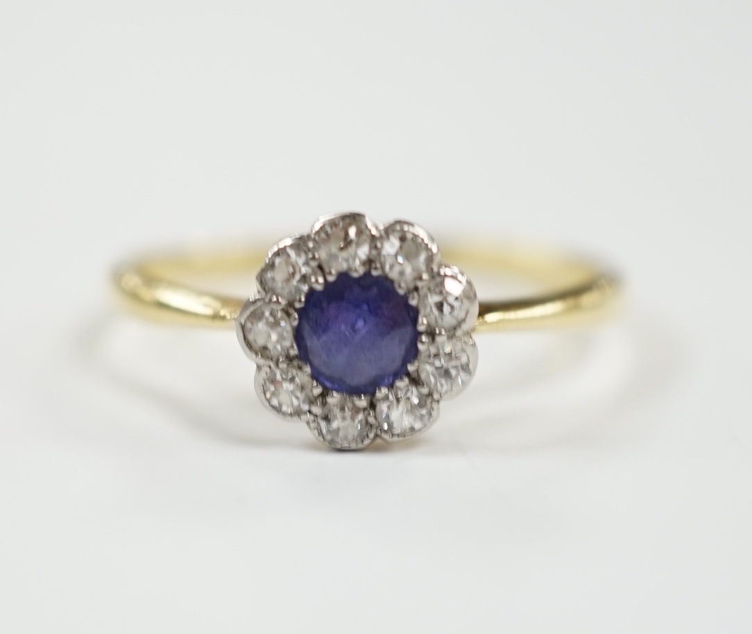 A 1920's 18ct & plat, sapphire and diamond set flower head cluster ring, size O/P, gross weight 2 grams.